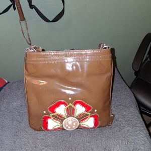Brighton Brown Crossbody Bag with Red and White Floral Design